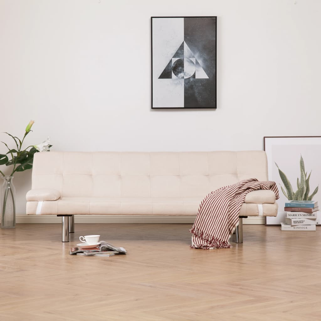 Beige sofa in a living room with a modern painting on the wall.