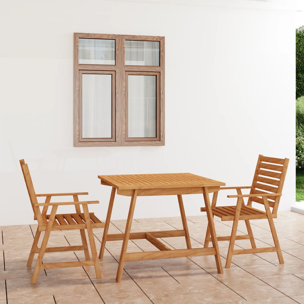 Wooden outdoor table and chairs on a wooden deck with a white wall and window in the background.