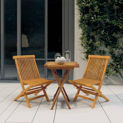 Wooden outdoor table with two chairs on a tiled patio