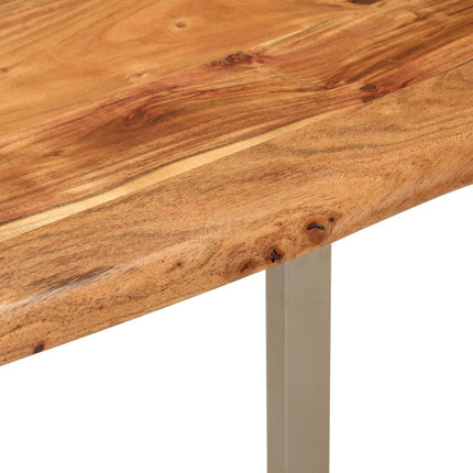Close-up of a wooden table with a metal leg on a white background
