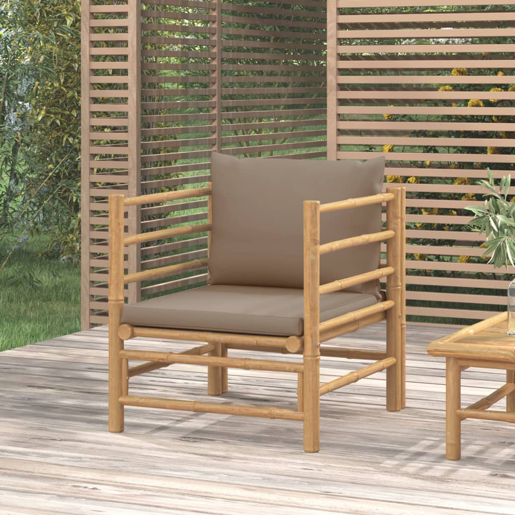 Wooden chair with a cushion on a wooden deck, surrounded by greenery.