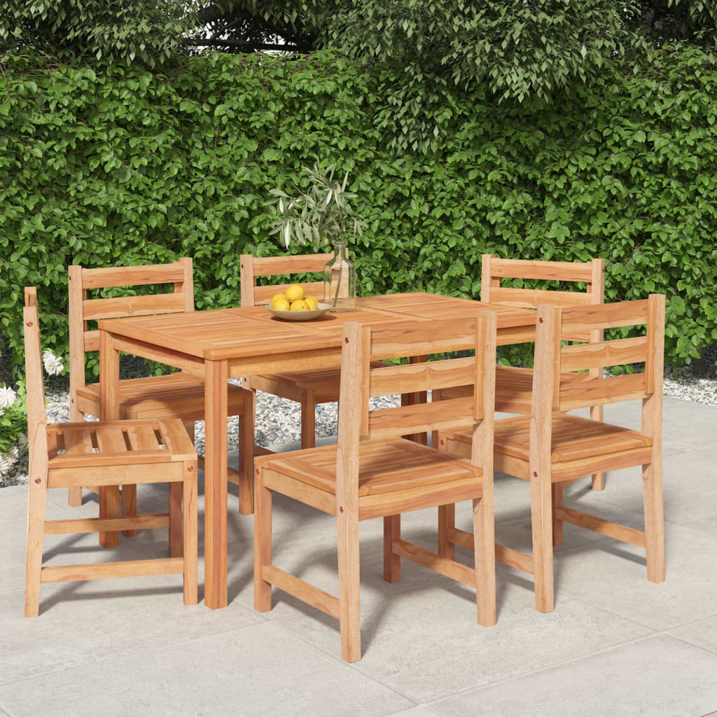Wooden outdoor dining set with table and chairs against a green hedge background