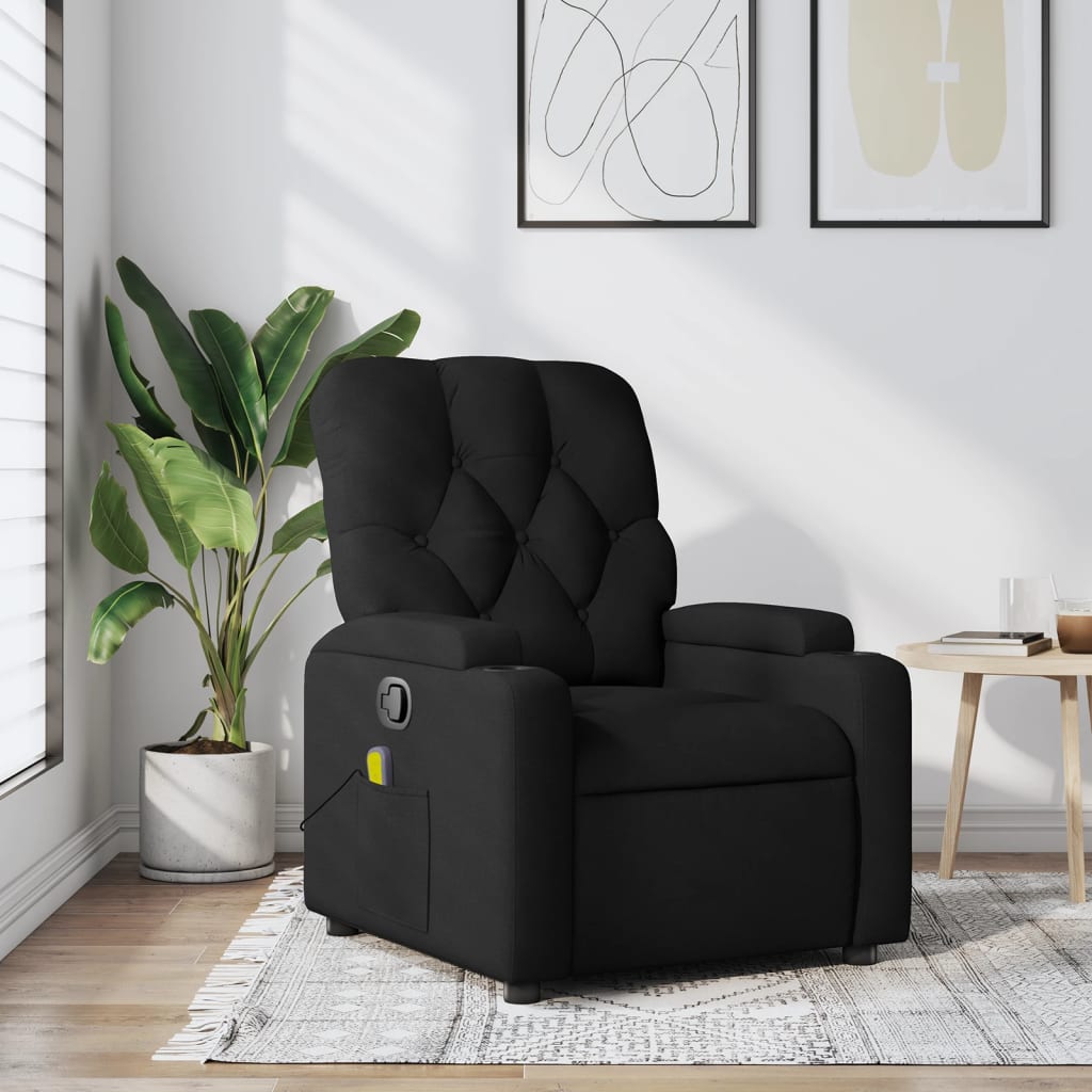 Black recliner chair in a modern living room with a plant and table.