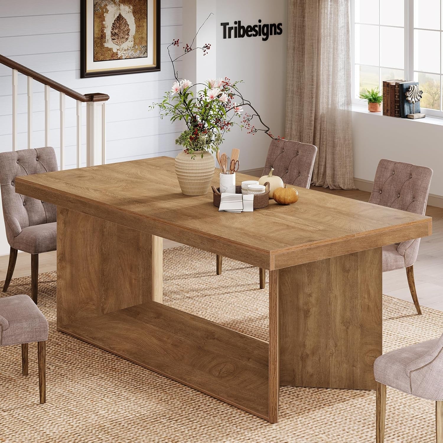 Wooden dining table with chairs in a room decorated with Tribesigns branding.