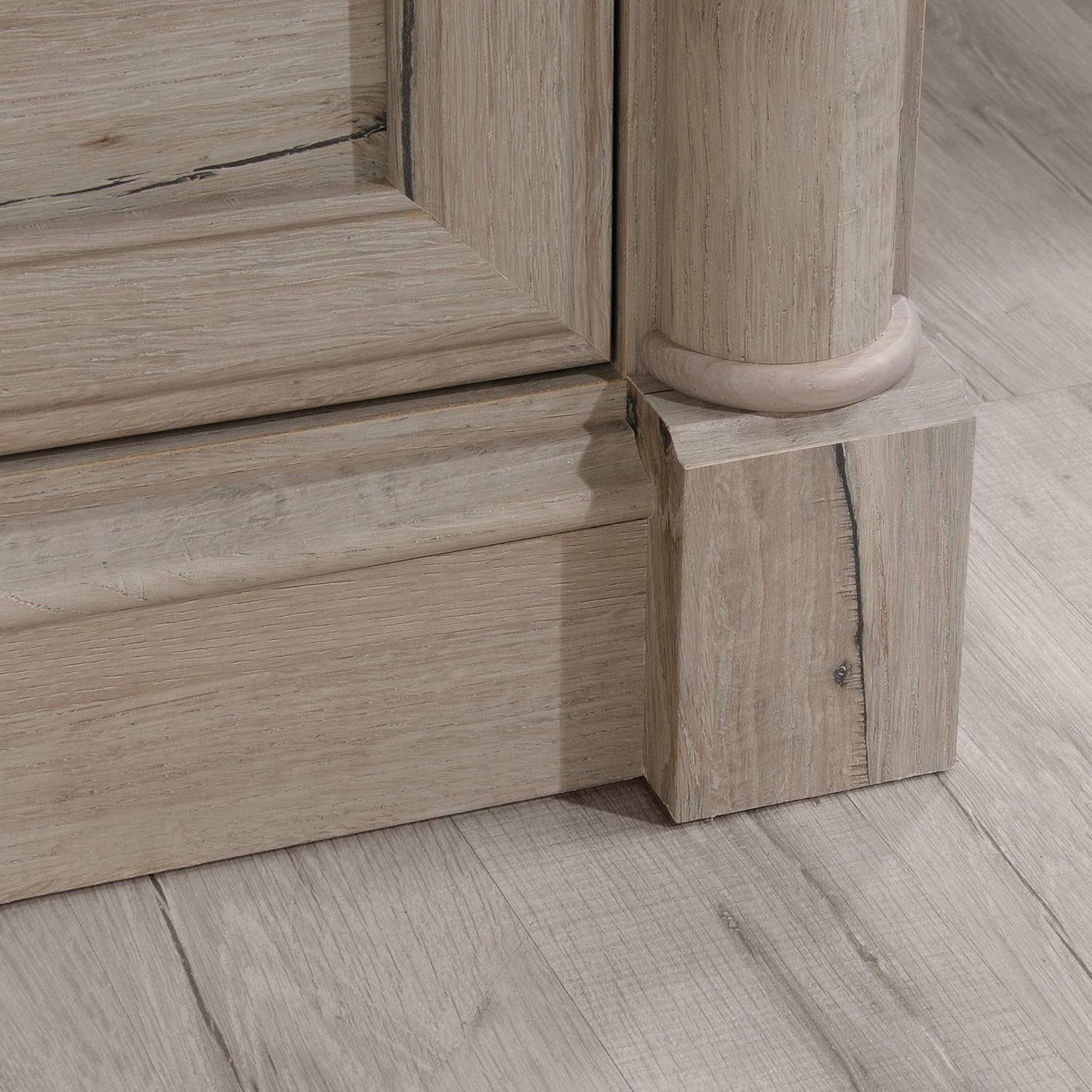 Close-up of wooden flooring with a focus on the joint between two planks.