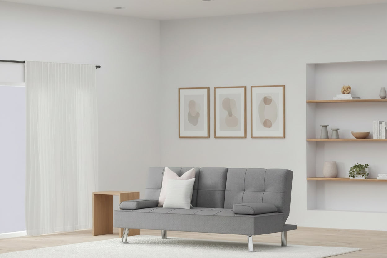 Modern living room with a gray sofa, wooden coffee table, and shelves.
