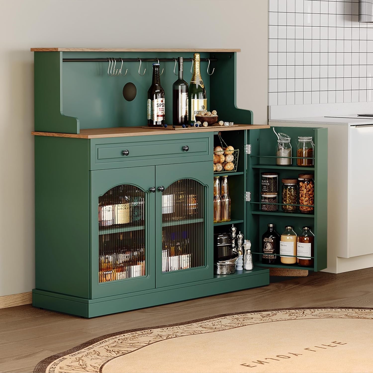 Green bar cabinet with shelves and bottles in a kitchen setting