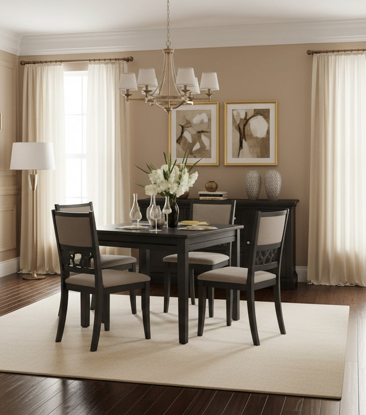 Dining room with a dark wooden table and chairs, featuring a vase of flowers on the table.