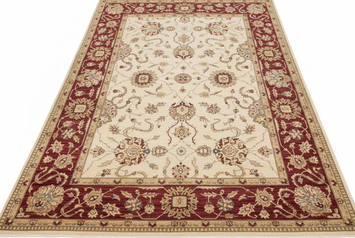Decorative red and beige area rug on a wooden floor