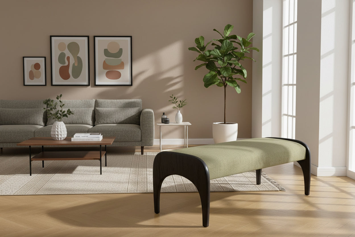 Green cushioned bench with a close-up of sturdy wooden legs on a textured floor.