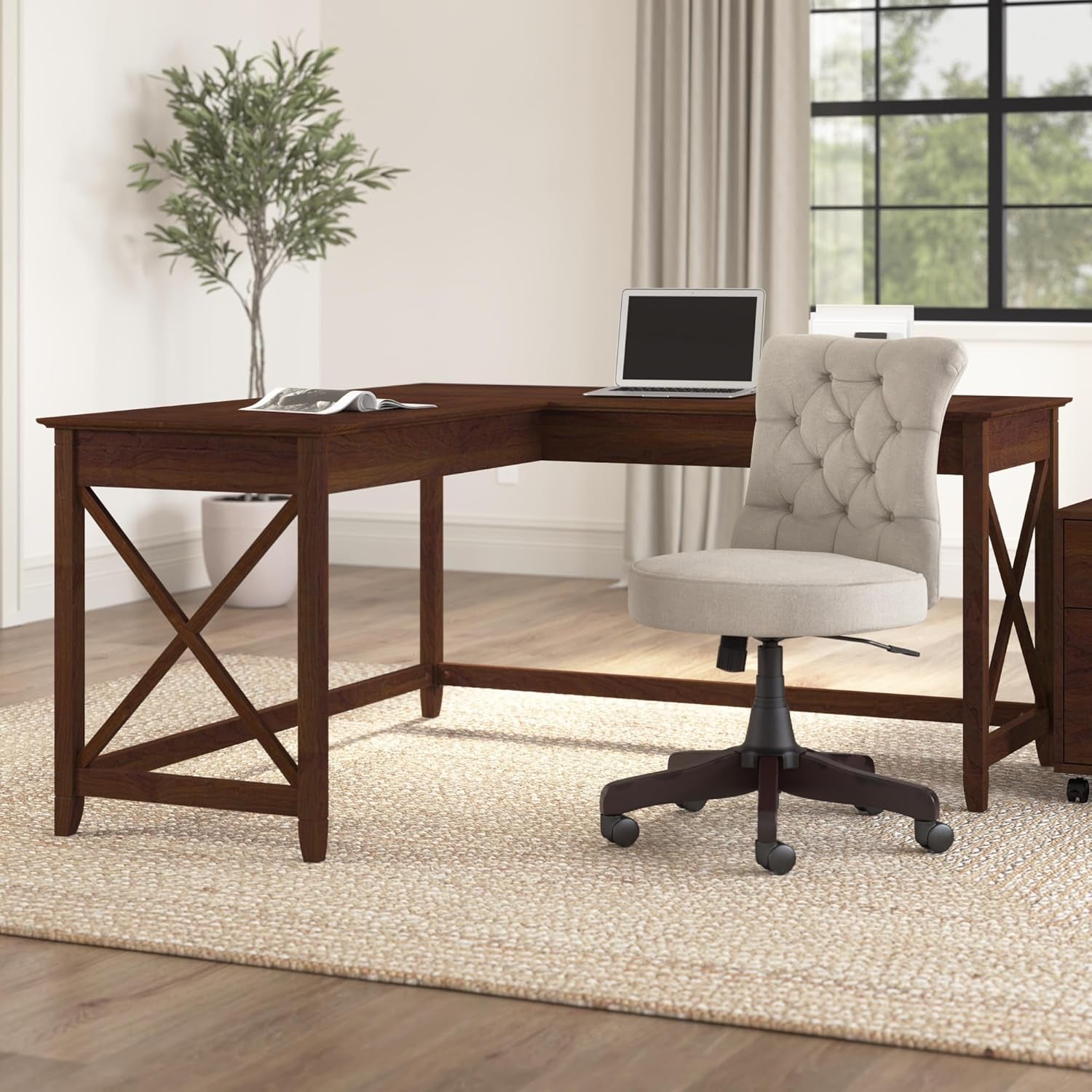 Wooden L-shaped desk with a chair in a home office setting