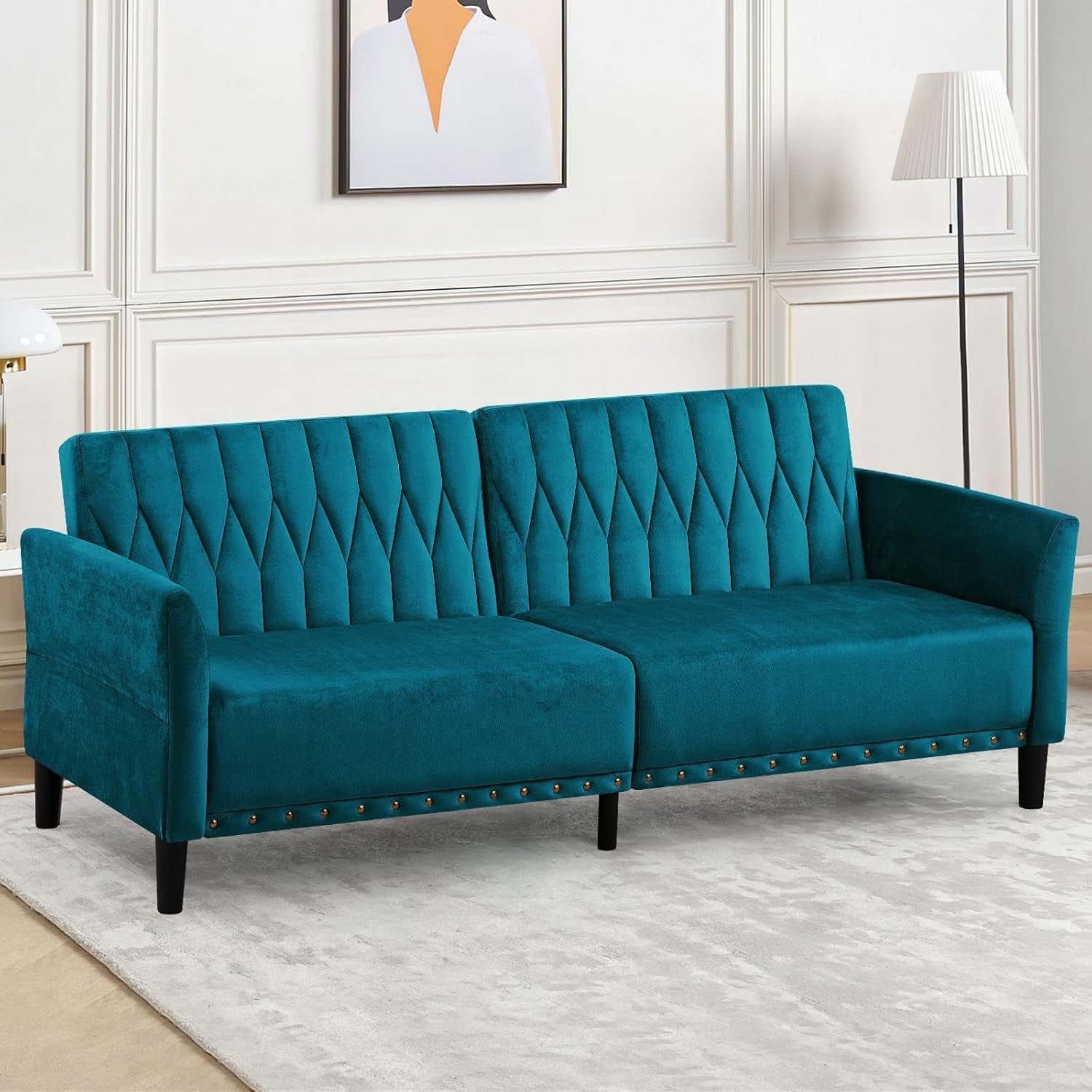 Teal sofa in a room with white walls and decor