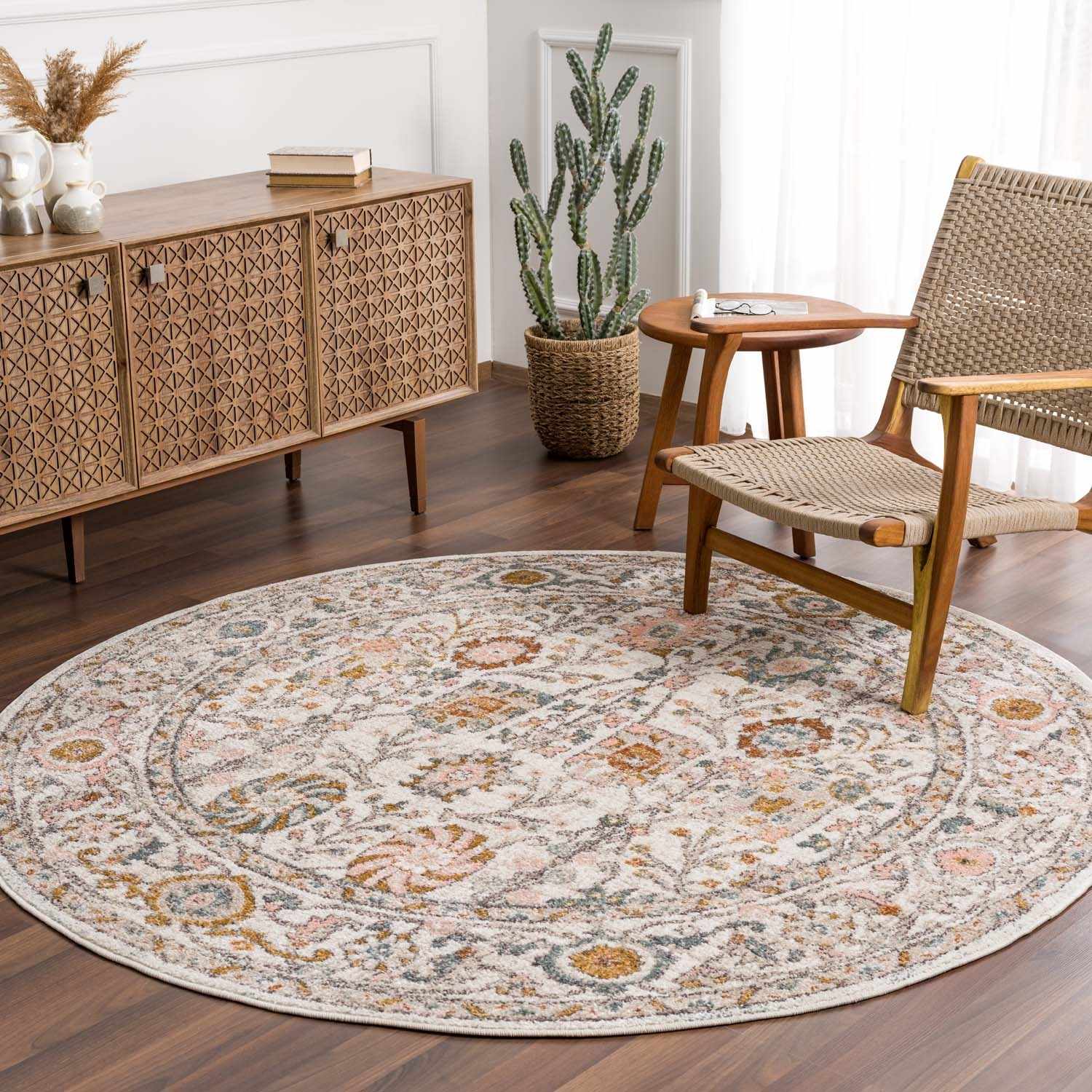 Round patterned rug in a living room with wooden furniture and decor.