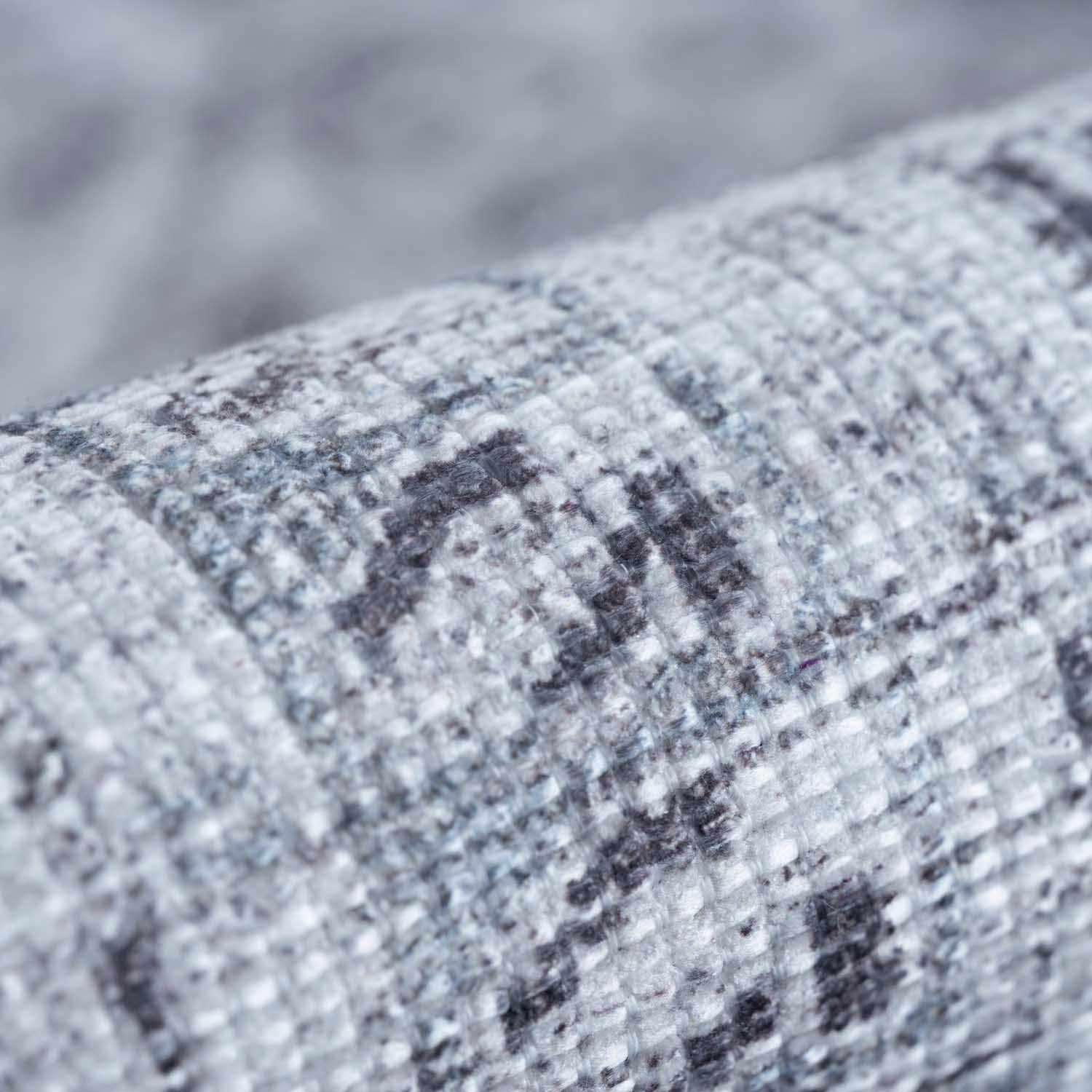 Close-up of a textured fabric with a pattern on a blurred background