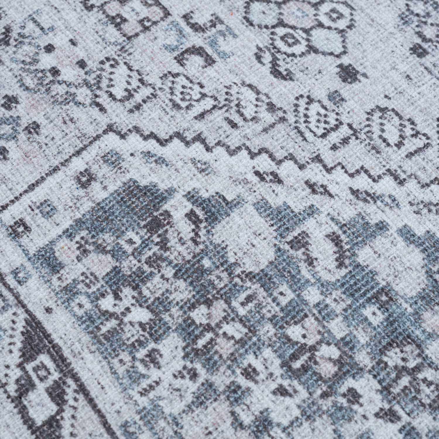 Close-up of a patterned rug with geometric design