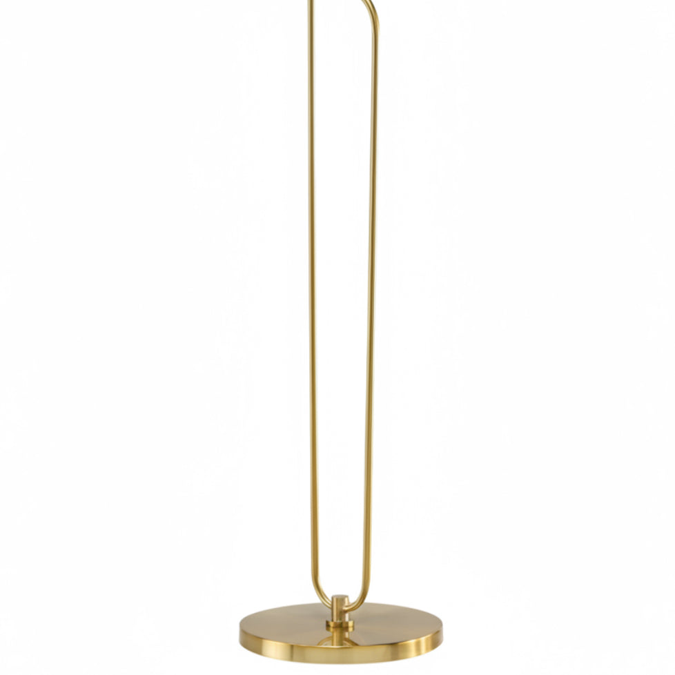 Gold floor lamp with a minimalist design on a white background