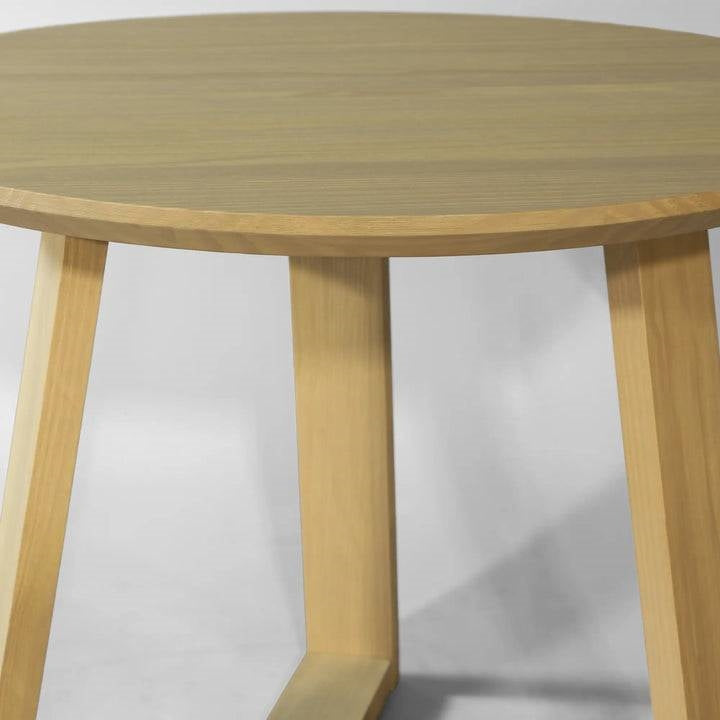 Wooden round table on a white background