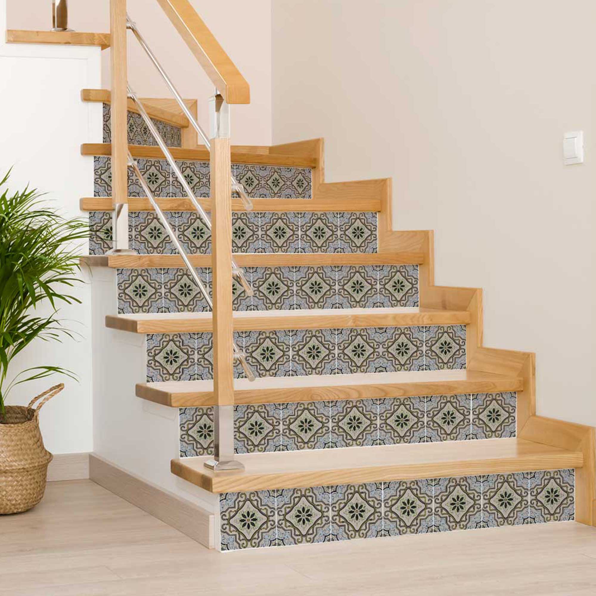 Wooden staircase with patterned stair stickers on a light wooden floor.