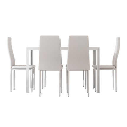 Dining table set with four chairs on a white background