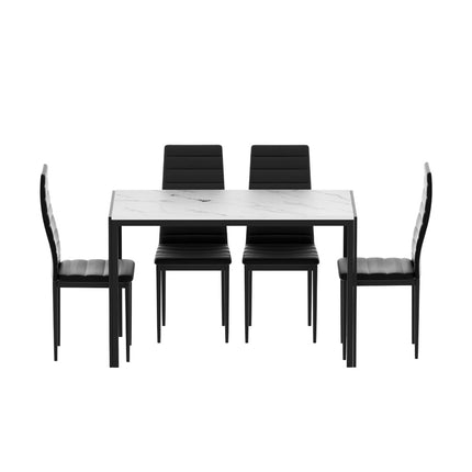 Dining table set with four chairs on a white background