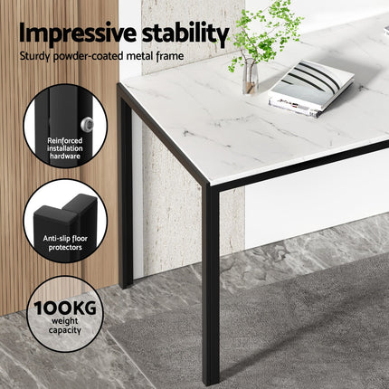 White marble top table with black metal legs on a gray floor, featuring stability and durability features.