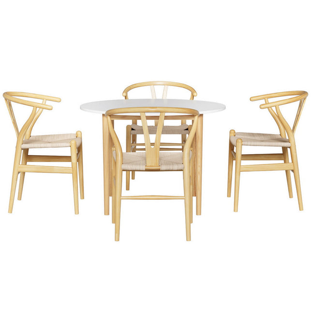 Dining set with round table and four chairs on a white background