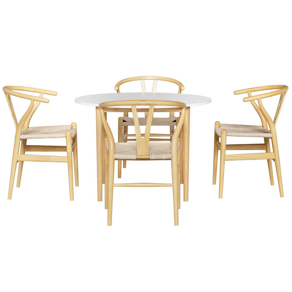 Dining set with round table and four chairs on a white background