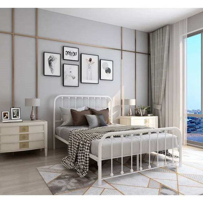 Modern bedroom with a white metal bed, nightstands, and decor.