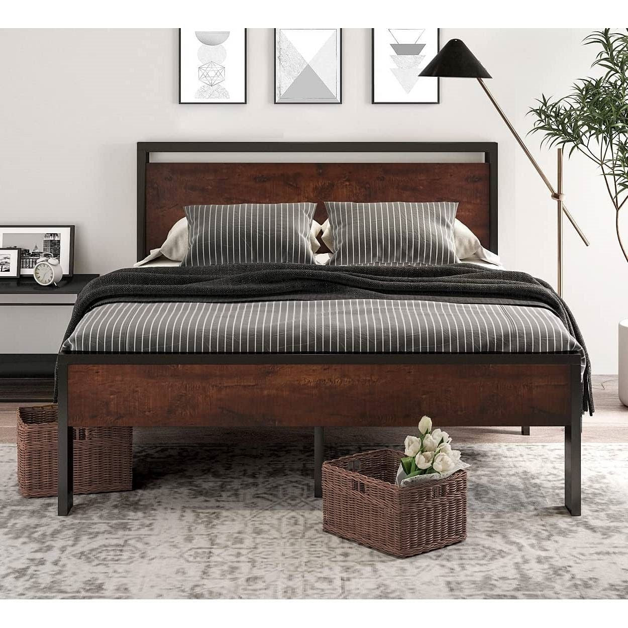 Wooden bed with striped bedding in a bedroom setting