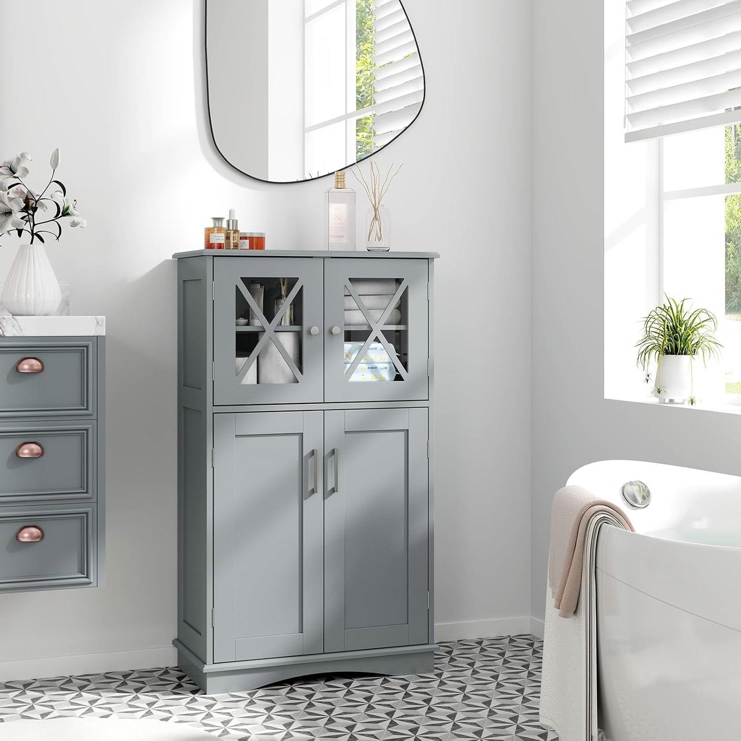 Gray cabinet in a bathroom with a mirror and window