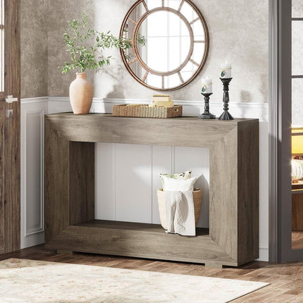 Wooden console table with decorative items in a room setting