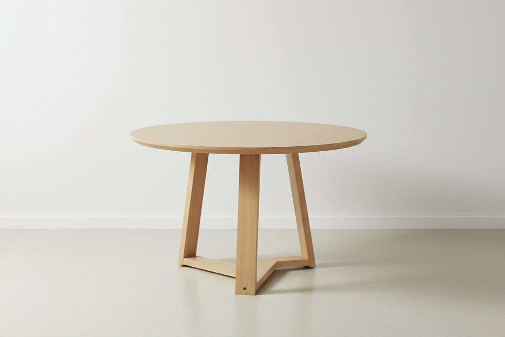 Round wooden table on a white background