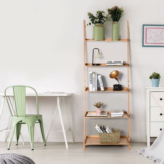 Wooden shelf with decorative items in a room with a desk and chair.