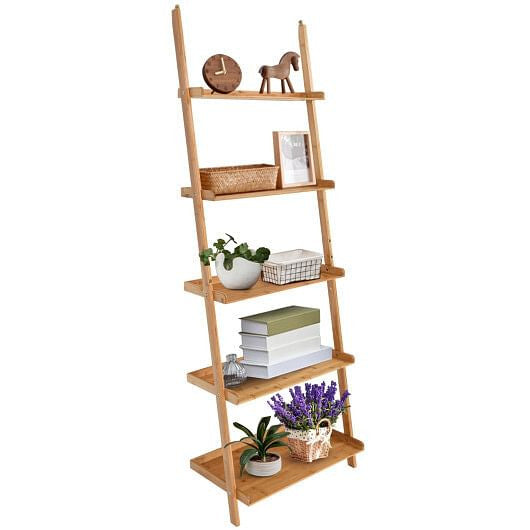 Wooden ladder shelf with decorative items on a white background