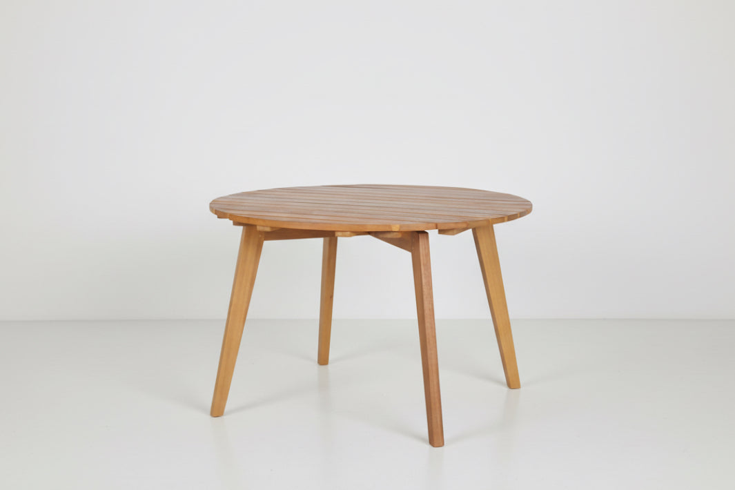 Round wooden table on a white background