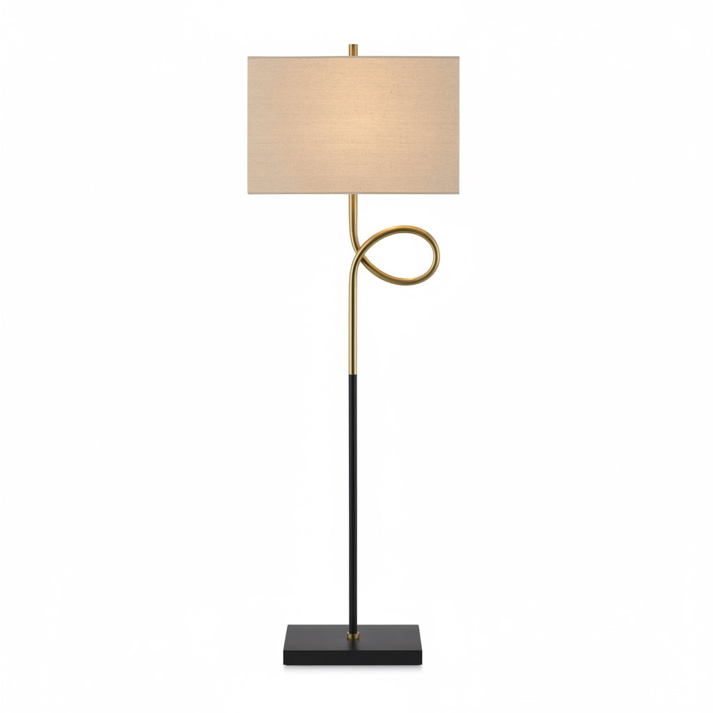 Floor lamp with black base, gold curved arm, and beige shade on a white background