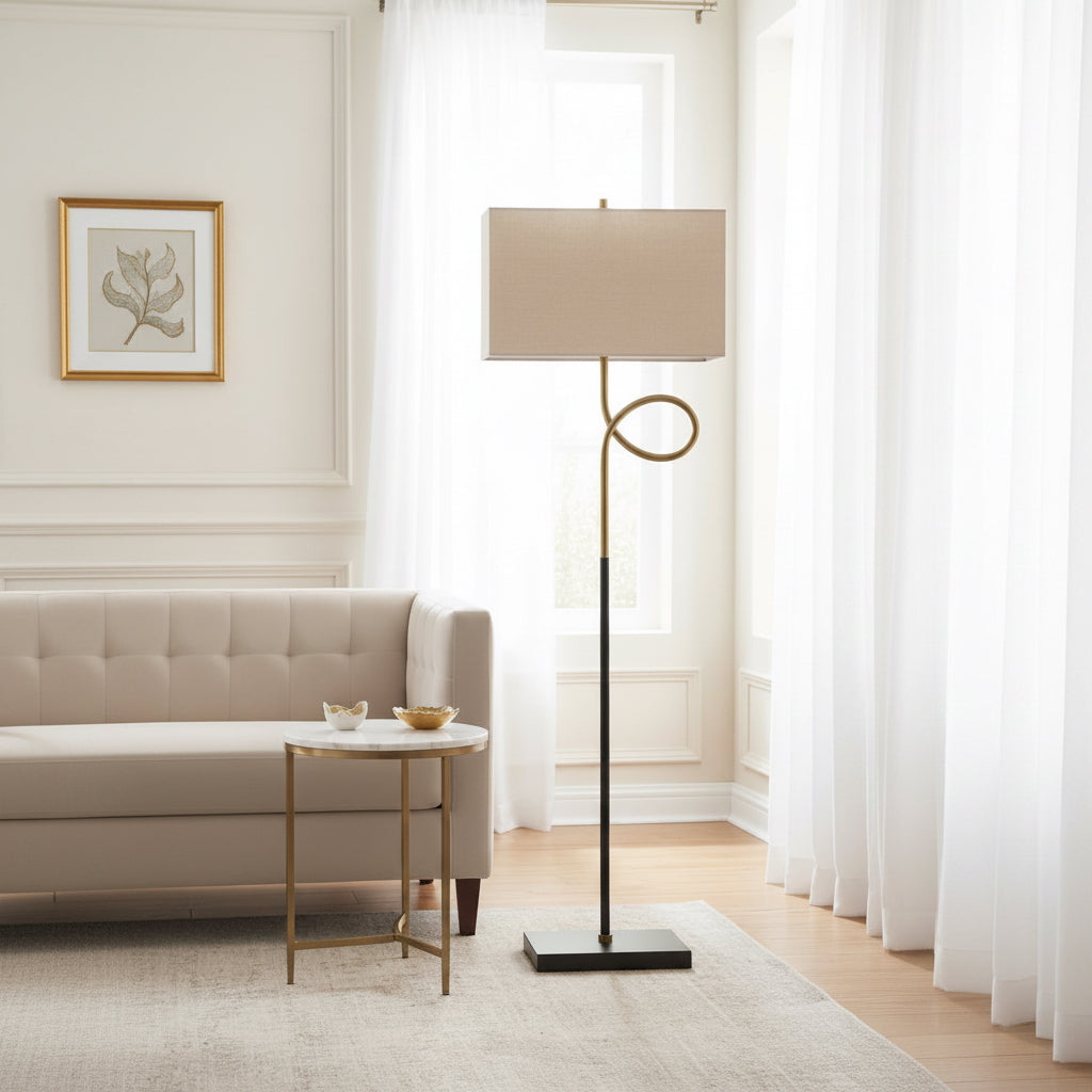 Floor lamp with a beige shade and black base on a white background