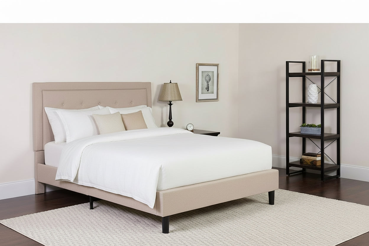 Beige bed with paisley bedding in a bedroom setting.