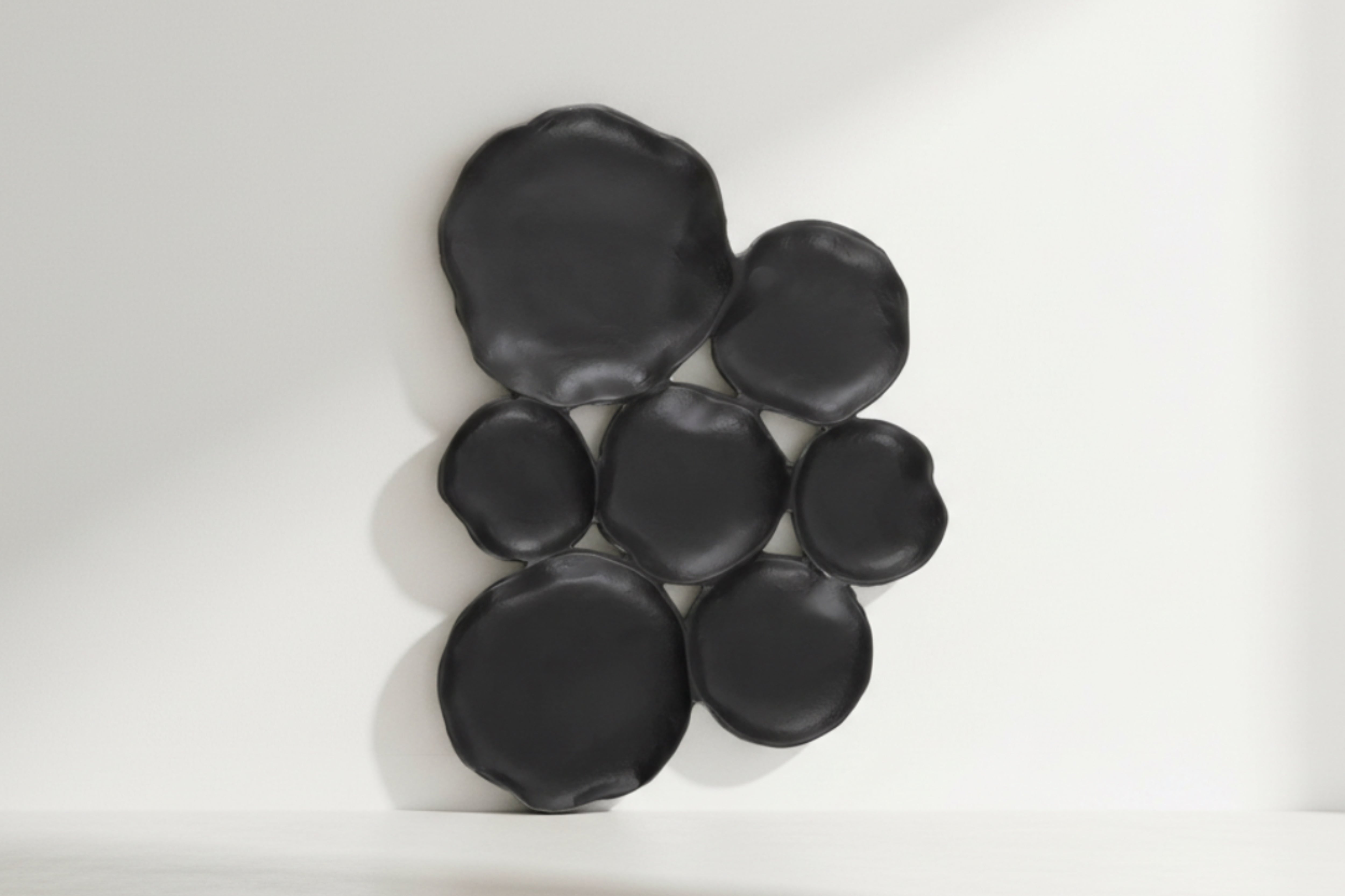 Set of black rubber duckies on a white background