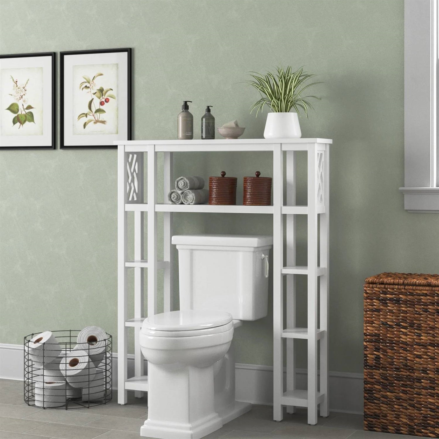 Bathroom with a white over-the-toilet shelf against a green wall.