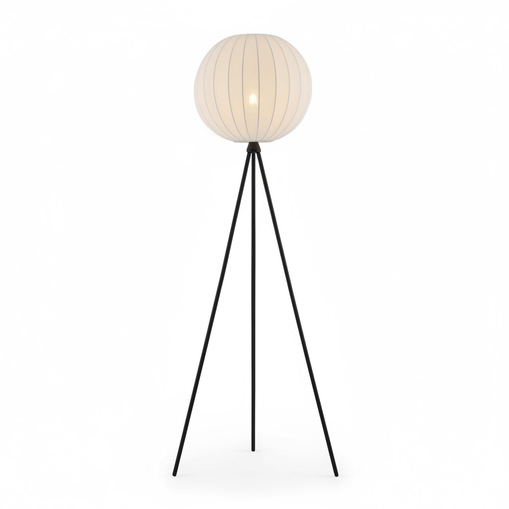 Floor lamp with a white spherical shade and black metal legs on a white background