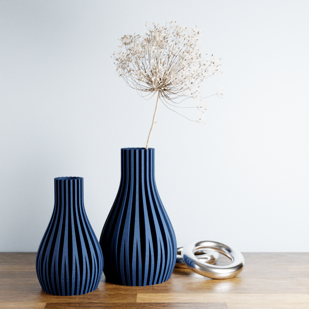 Two blue striped vases on a wooden surface with a plain background