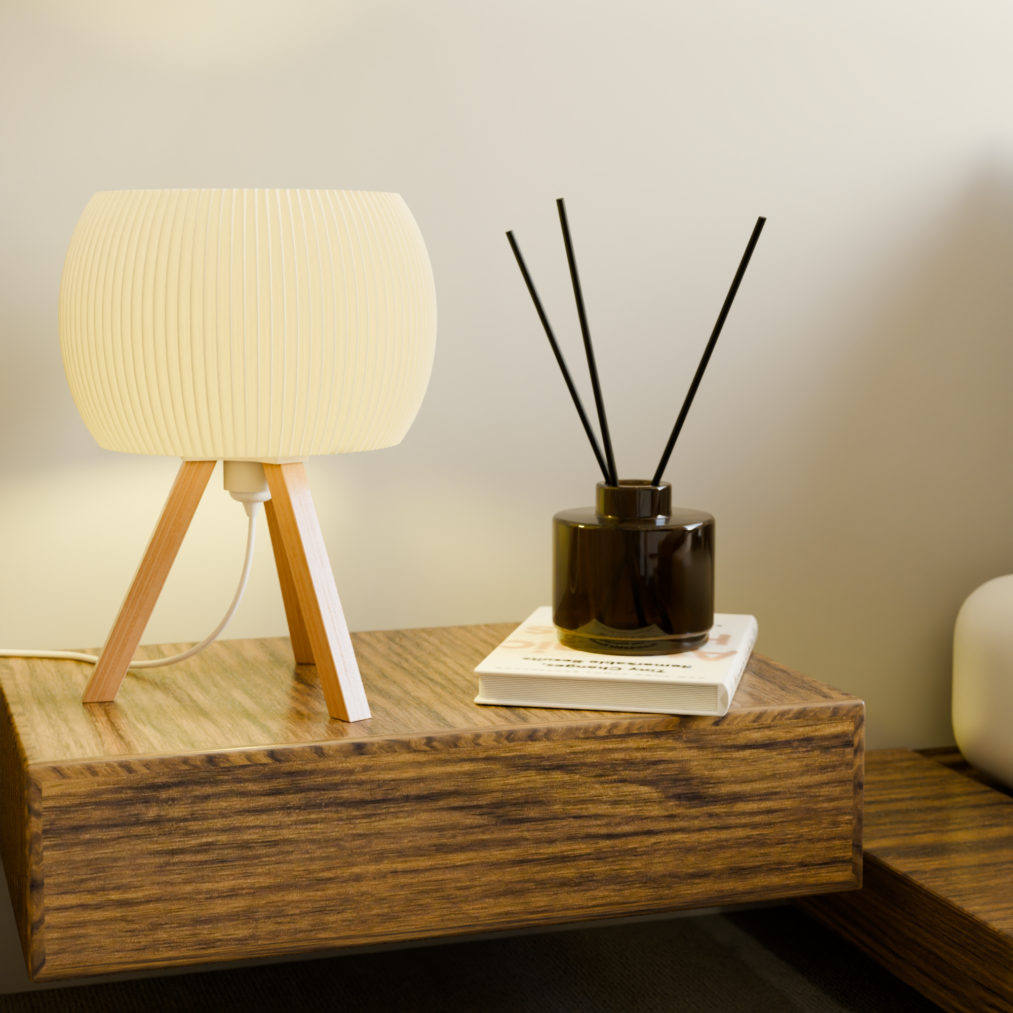 Table lamp and diffuser on a wooden surface with a neutral background