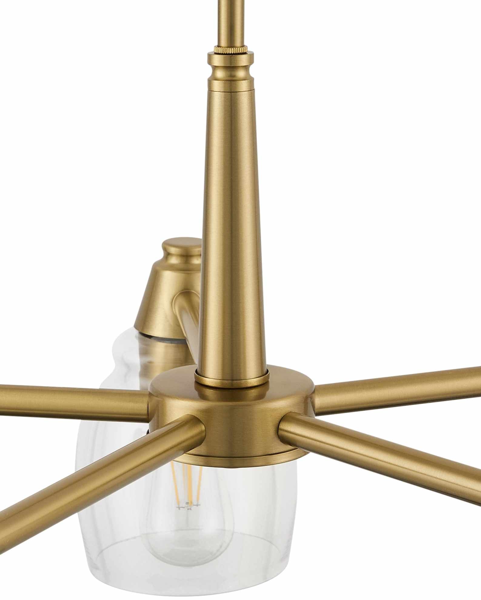 Gold pendant light fixture with clear glass shade on a white background