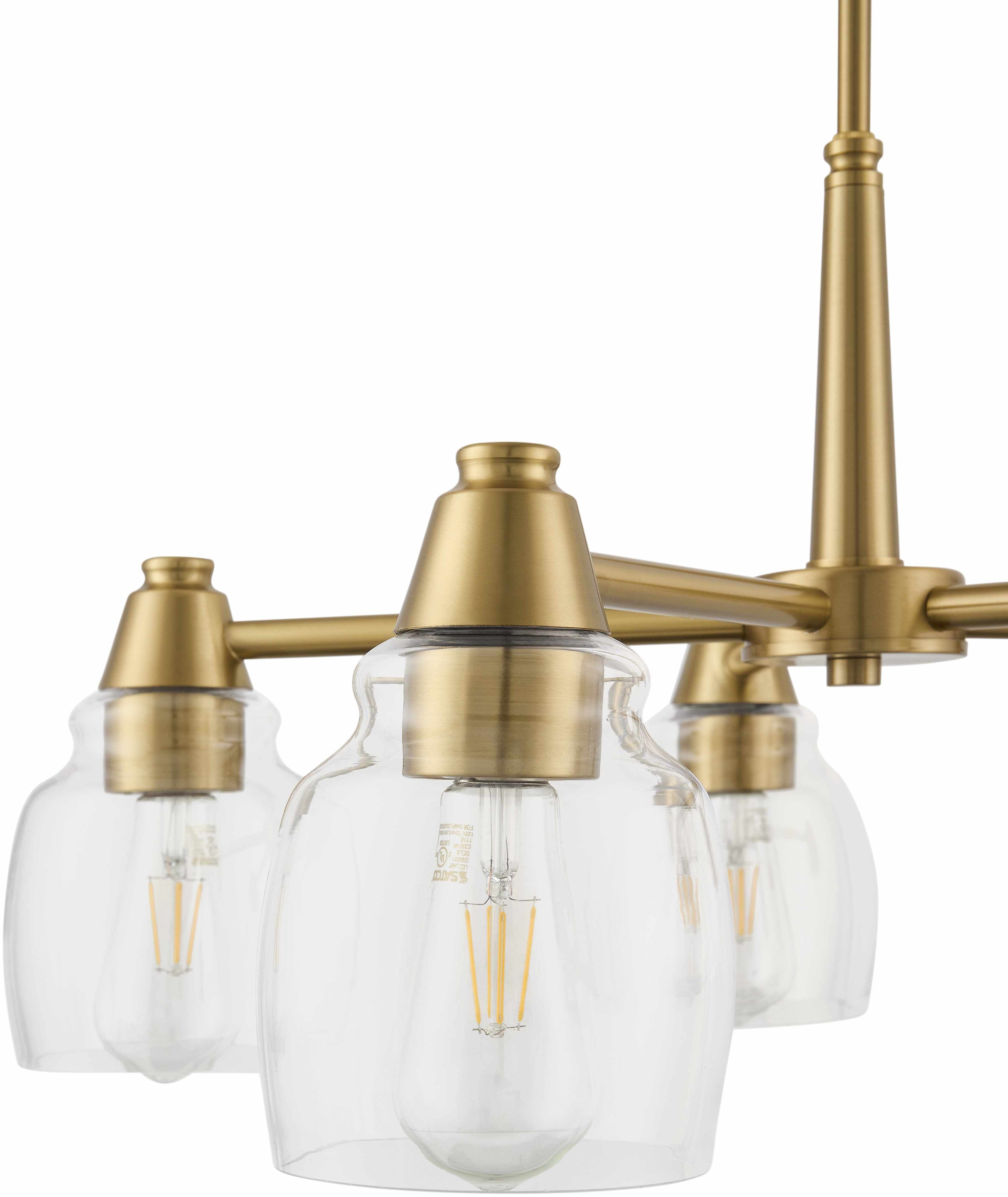 Modern pendant light fixture with gold metal and clear glass shades on a white background