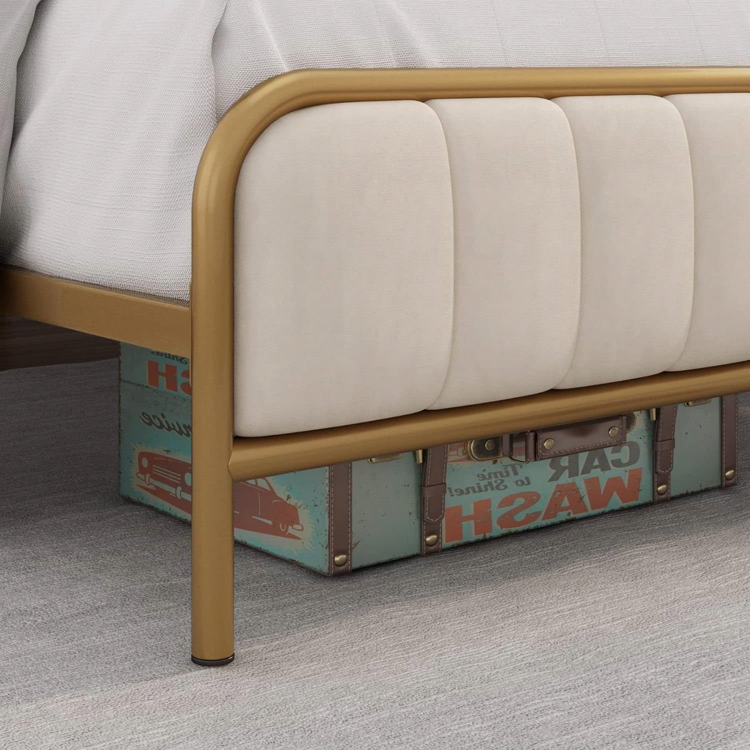 Gold bed frame with beige cushion on a gray carpet