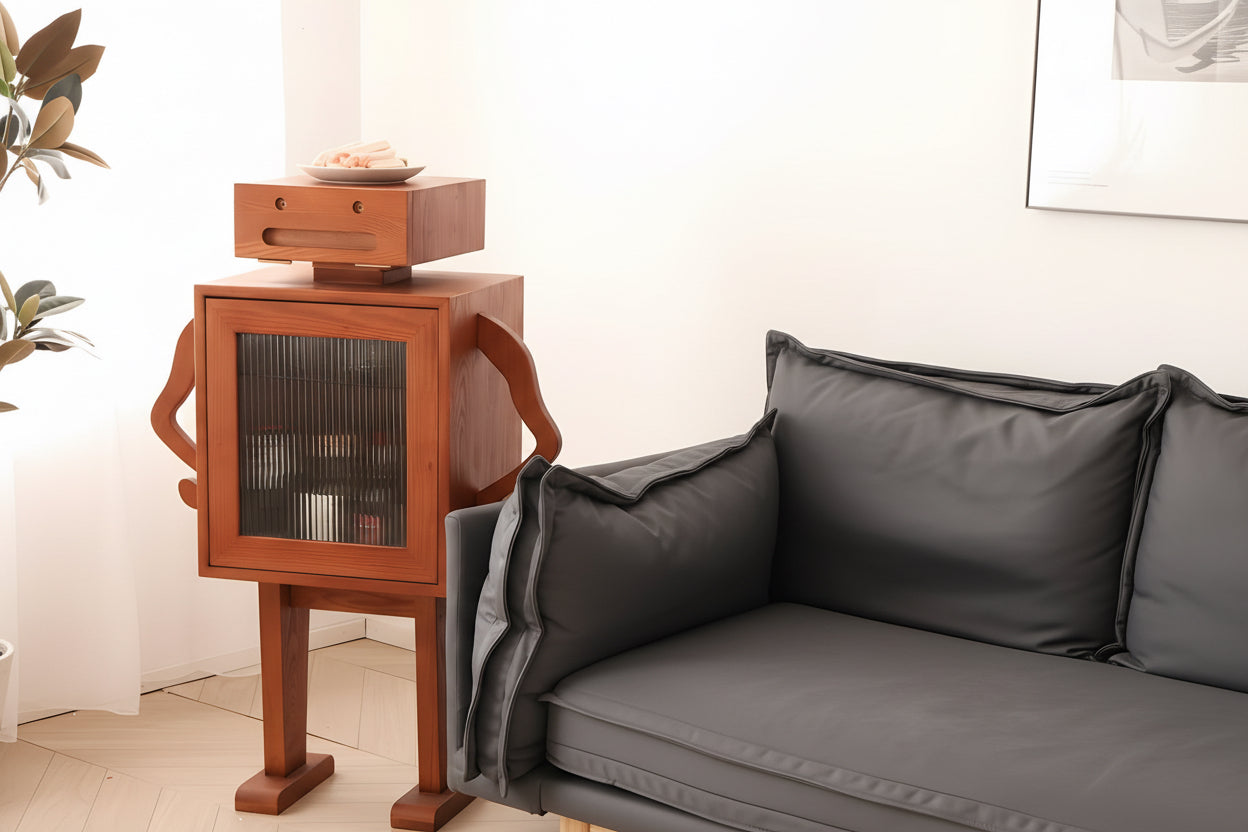 Woman sitting on a couch next to a wooden robot sculpture in a modern living room.