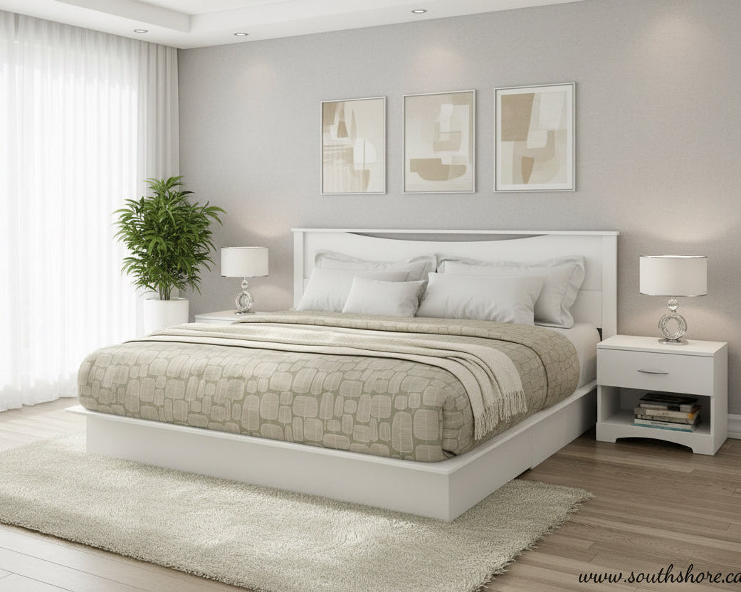 White bed with stone-patterned comforter in a bedroom setting with nightstands and lamps.