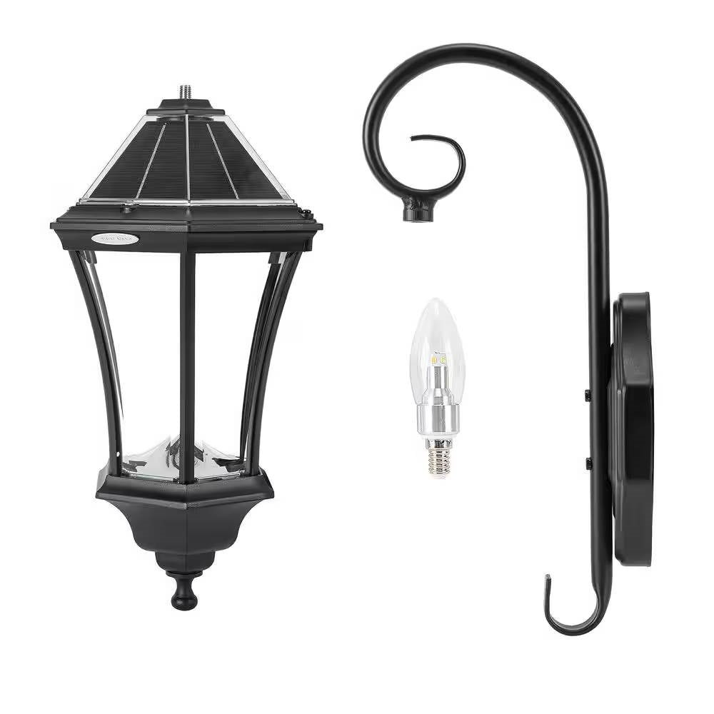Black outdoor wall light fixture with a bulb on a white background
