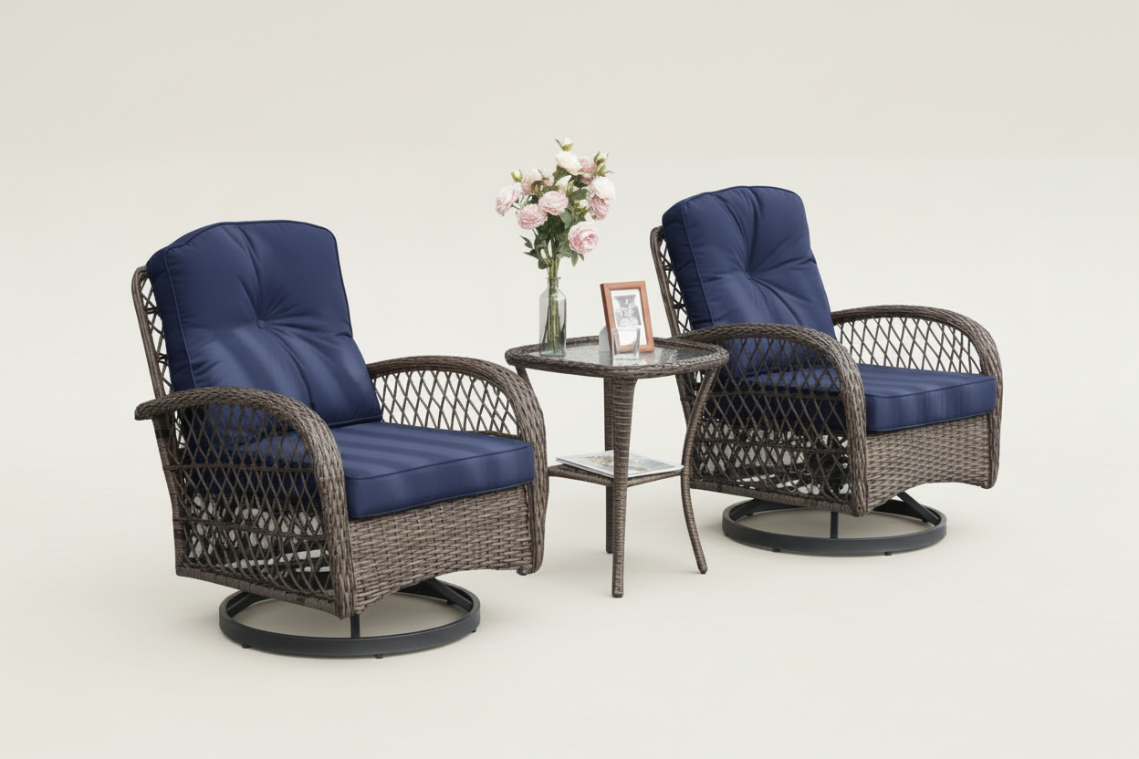 Two wicker chairs with blue cushions on a patio with a small table and flowers.